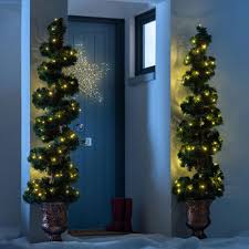 The evergreen fir tree has traditionally been used to celebrate winter festivals (pagan and christian) for thousands of years. Pre Lit Spiral Potted Christmas Tree With 150 Chasing Warm Led Lights We R Christmas