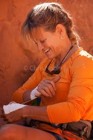 Kitty Calhoun preparing to climb in Southern Utah