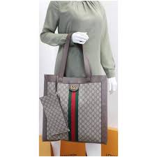 Crafted in gg supreme canvas with inlaid green and red web stripe, the accessory is enhanced by a petite play on the double g, an archival gucci code from the '70s that appears atop a. Gucci Ophidia Soft Gg Supreme Large Tote Bag Beige 519335