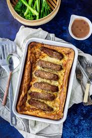 Toad in the hole or sausage toad is a traditional english dish consisting of sausages in yorkshire pudding batter, usually served with onion gravy and vegetables. Vegetarian Toad In The Hole With Red Onion Gravy The Cook Report