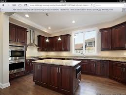 Black And Light Wood Kitchen Cabinets Cabinets Kitchen Paint Colors With Light Wood For Oak And Black Appliances Dark Tile Floor Wood Floor Kitchen Kitchen Cabinets And Flooring Light Wood Kitchens