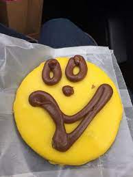 Alex Brown Shows Off A Huge Smiley Face Cookie From Ryals Bakery Bakery Deserts Food