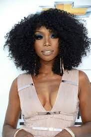 Low buns are a classic and elegant hairstyle. 19 Celebrities Who Rock Natural Hair Natural Hair Styles Celebrity Hairstyles Hair Inspiration
