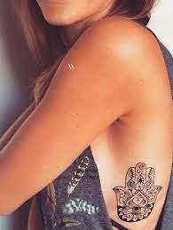 I Was On About Getting A Tattoo Like This But Had No Clue On Where To Place It But I Think It Looks Pretty On The Rib Ca Hamsa Hand Tattoo