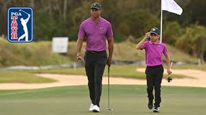 Woods keeps the club in front of his torso, and the clubhead stays outside the path of his hands and close to the target line. Tiger And Charlie In Sync Like Father Like Son At The Pnc Championship Youtube