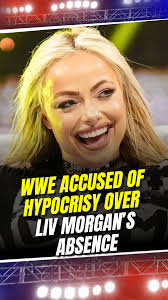 WWE called out for hypocrisy! 🤔 Liv Morgan's absence raises eyebrows. 👀  What do you think, should she be featured? 💭, ., ., ., #WWEDrama  #LivMorgan #VinceRusso #WrestlingTalk #InjuryDebate