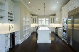 If you don't want to go dark, you can still keep the light feel of the kitchen without going all the way white or cream. White Kitchen Cabinets With Dark Wood Floors Transitional Kitchen Bakes And Company