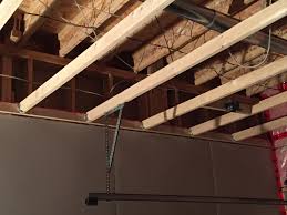 Support the joist with ply pad and 2x4 with slight pressure on the ceiling. Garage Ceiling Joists Reinforcement Doityourself Com Community Forums