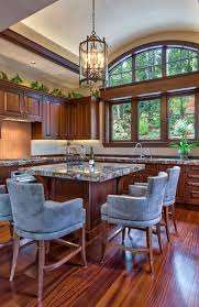 The golden tones of the maple are light enough that your kitchen won't be overpowered by the cabinet and flooring combination as it might be with a darker wood like mahogany. 30 Classy Projects With Dark Kitchen Cabinets Luxury Home Remodeling Sebring Design Build