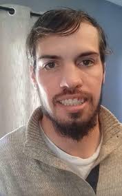 Portrait of a man with dreads.