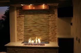 It features a column that pours the water out the sides into a lower basin that is raised off the ground around the column. Fire And Water Features Houzz