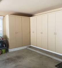 Easily hose down your garage floors without damaging cabinets or baseboards. Garage Cabinets Garage Interiors