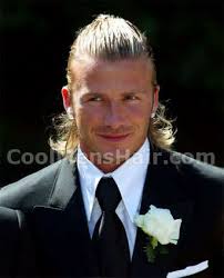 It's a long style that is put into two ponytails. David Beckham Hairstyle Real Madrid