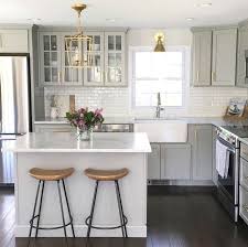 Small Kitchen With Island Grey Cabinets Gold Fixtures Marble Counters Kitchen Remodel Small Kitchen Design Kitchen Inspirations