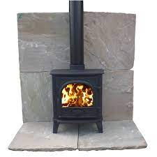 This beautiful wood stove board is manufactured in the united states using a special thin set bonding technique to give it the flexibility needed to withstand the weight of heavy stoves without cracking or splitting. Stone Slab Hearth Google Search Wood Stove Hearth Wood Stove Fireplace Slate Hearth