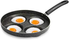 It's also designed with sloped sides to allow for smooth rolling and tossing. Amazon Com Multi Egg Frying Pan Multiple Egg Cooker Fried Poached Egg Pan For Gas Stove Perfect For Poaching Eggs M W Kitchen Dining