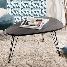 La table basse relevable ou encore appelée table basse transformable est ce que l'on appelle un meuble « gain de place ». Table Basse Forme Galet Retro Bois Et Pieds Metal Noir En Epingle 4 Tiges 97x65x50cm Landaise Tables Basses Pier Import