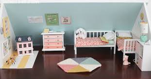 The dollhouse is in the form of a suitcase. Diy Dollhouse The Girls Bedroom And Nursery