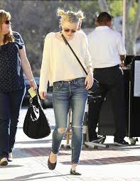 The actress hit the streets. Dakota Fanning Wearing Ankle Zip Jeans Denimology
