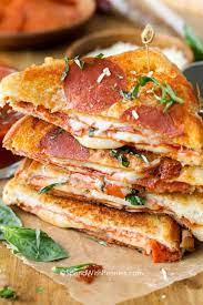 In This Pizza Grilled Cheese Recipe A Classic Grilled Cheese Sandwich Is Updated With Pizza Grilled Cheese Pizza Grilled Cheese Recipes Grilled Cheese Recipes