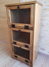The front has a cut out star with poultry netting behind it. Amish Made Solid Pine Wood Vegetable Bin