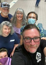 who was the masked man at the meeting?