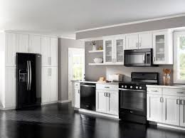Black Appliances White Light Grey Cabinets And Darker Grey Walls All I Want But With Black Appliances Kitchen White Cabinets Black Appliances Kitchen Design