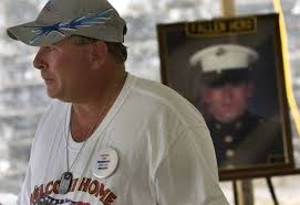 GARY QUALLS of Temple, Texas holds back tears while talking about his son  Louis W. Qualls pictured
