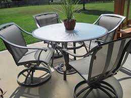 Patio Table And Chairs With Functionality And Comfort Darbylanefurniture Com Round Patio Table Cast Iron Patio Furniture Wrought Iron Patio Furniture