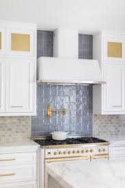 We did not find results for: Bright Kitchen Features A Neutral And Blue Patterned Tile Backsplash And White Cabinets With Gold Hardware Hgtv
