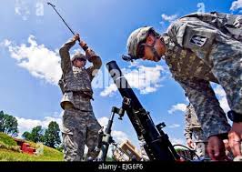 Indiana National Guard Spc. Robert Nuckles, right, and California National  Guard Sgt. Dieter Meza troubleshoot their radios at Fort Polk, Louisiana,  Wednesday, July 19, 2017. Nuckles, of Greenwood, Indiana , and Meza,