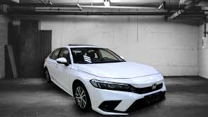 Hard buttons line up in a row under the screen to offer shortcuts to phone, media, radio, audio, and other functions. 2022 Honda Civic Appears In Live Images Design Features Revealed Newsbytes