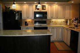 Kitchen with white cabinets and black appliances. Dark Kitchen Cabinets With Black Appliances