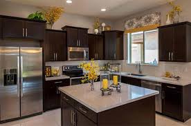 The top of your cabinets is a great place to grow a climbing plant , like a philodendron, pothos or ivy, especially if you have a lot of natural light and high windows in your kitchen. How To Decorate The Top Of Kitchen Cabinets Home Design Lover