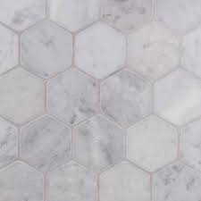 Large hexagon floor tiles work well in larger spaces to cover the floor without as much contrasting grout, creating fewer busy lines. Italian Carrara Hexagon Mosaic Large Lapicida Lapicida
