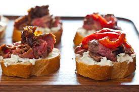 Flank Steak With Goat Cheese On Toast Recipe Tapas Recipes Food Spanish Tapas Recipes
