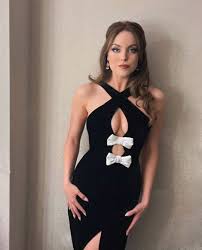 Elizabeth Gillies excels in a captivating black dress…