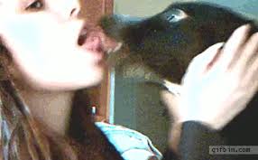 Woman Kissing Dog