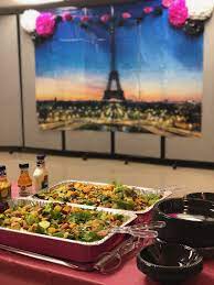 Especially if i am having a large gathering where some people arrive. Soup Salad Paris Themed Buffet Pink Serving Trays And Mural In Background From Party City Dinner Theme Soup And Salad Party City