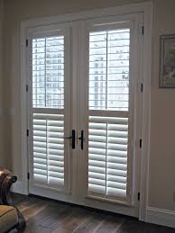 Actually, french door window treatment is almost the same as with usual windows: Interior Simple White Venetian Blinds On Bi Fold Glass Door Blinds For Patio Doors Windowcoveri Patio Door Blinds Blinds For French Doors French Door Shutters