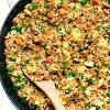 Wash the rice well several times, then soak it in warm water for twenty minutes. 1
