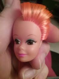 Rerooting a vintage Barbie, decided to go with orange :)