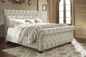 California king size mattresses measure 72 by 84 inches and are suitable for extra tall individuals and couples. Willenburg Linen Cal King Upholstered Sleigh Bed From Ashley Coleman Furniture
