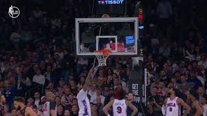 Teamwork? KAT helps Drummond retrieve ball wedged behind backboard