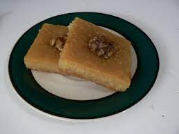 Basically basbousa (also known as revani or harissa) cake is a semolina cake with coconut. Basbousa Wikipedia