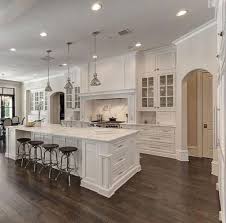 The cream countertops give breaks to the white. 41 Stunning Luxury White Kitchen Design Ideas Kitchendesign White Kitchen Design Kitchen Cabinet Design Off White Kitchens