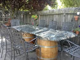 Our Table In Backyard 900lb Granite Slab With Chiseled Edges Wine Barrel Legs Steel Frame Under Table And Attched Steel Legs Go Patio Design Patio Backyard