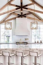 But this kitchen takes advantage of the extra space with specialty wine storage. 18 Vaulted Ceiling Designs That Deserve Your Attention