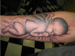 On the inner side of his right arm, there is a portrait of a lady along with a baby's face inked. Top 7 Beautiful Baby Tattoo Designs Styles At Life