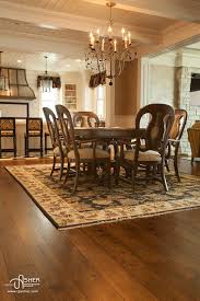 Manomin Antique Elm Flooring In Dining Room Dark Wood Table And Chairs With Over Hanging Chandelier Reclaimed Wood Floors Dark Wood Table Reclaimed Hardwood